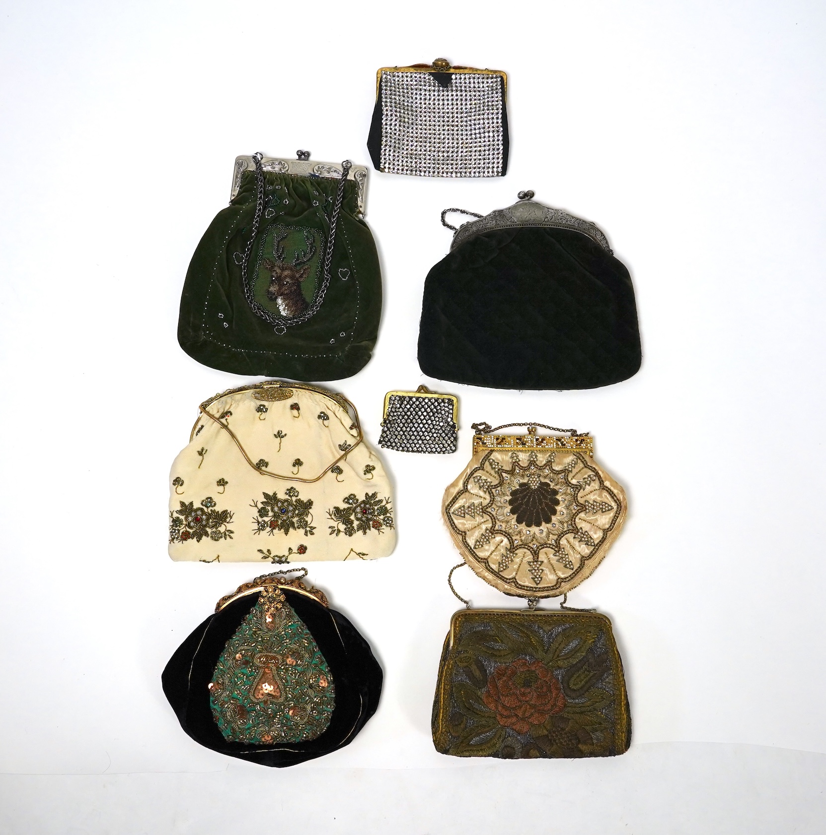 Mixed evening bags; including a 19th century velvet and cut steel handbag, a similar bag, three later gold metallic embroidered evening bags, a mixed metalic evening bag and a diamonte bag and purse (8)